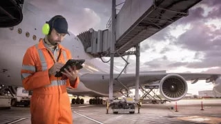 Airport worker with tablet