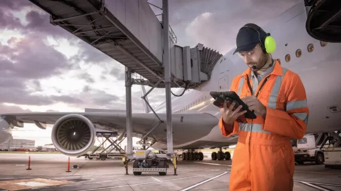 Airport worker with tablet