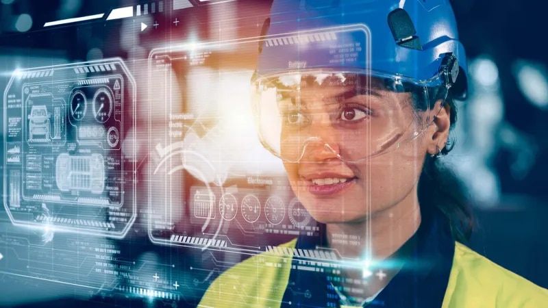 Factory worker working with AI