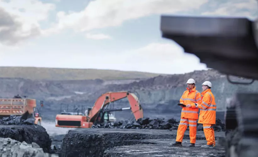 Mine workers with rugged devices